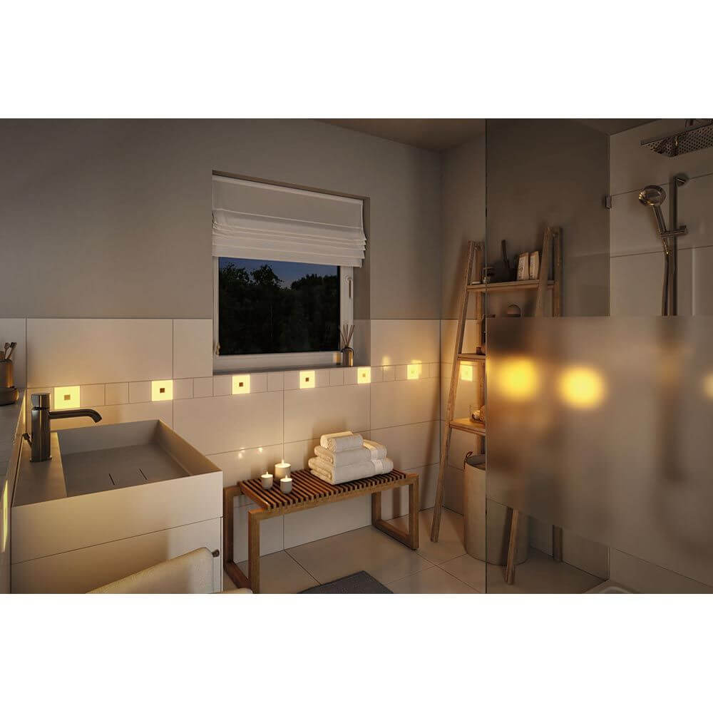 Modernes Badezimmer mit LumiTiles LED Fliesen in RGBW, gemütlicher Atmosphäre und entspannender Beleuchtung.