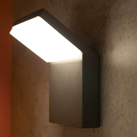 Alpine outdoor-LED wall light with a square design and elegant lighting effect mounted on a wall.
