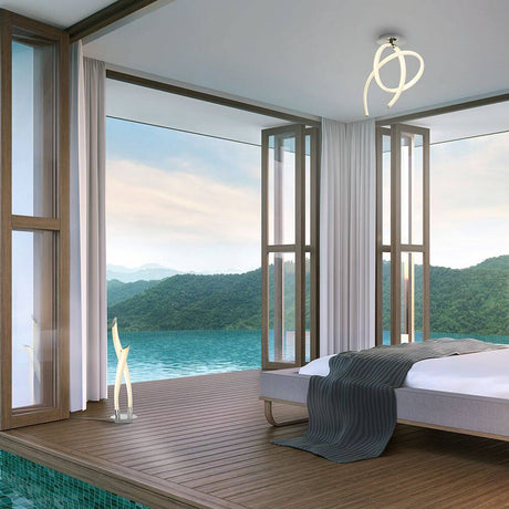 Armonia vertikal LED-Deckenleuchte in einem modernen Schlafzimmer mit Aussicht auf die Natur.