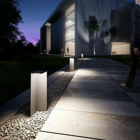 Chevalier solar outdoor path light in a stylish setting at night, ideal for outdoor areas.