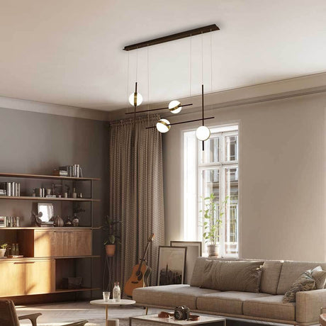 Cuba LED asymmetrical pendant light in modern living room with sofa and bookshelf.