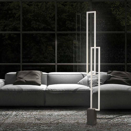 Mural Dimmable LED Floor Lamp White-Matte in a modern living space with a sofa in the background.