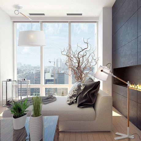 Modern living area with the Nordica wooden floor lamp as a stylish lighting feature in the living room.