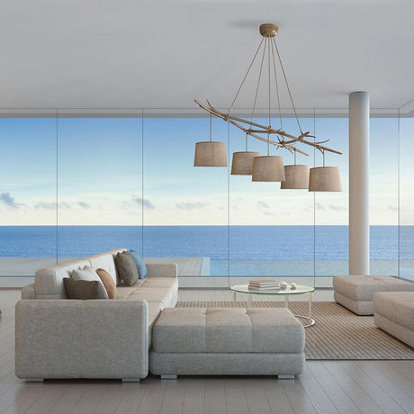 Modern living room landscape with Sabina 5-light textile pendant light and sea view.