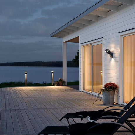 Massa LED outdoor wall light anthracite, clear acrylic glass on a modern facade with a view of the lake.
