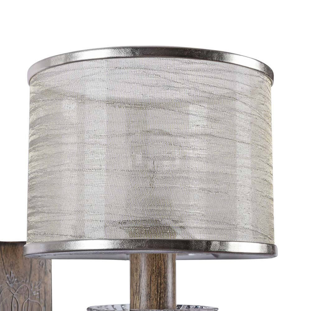 Cable Wandleuchte Braun mit transparentem Organza Lampenschirm und filigraner Drahtmuster-Verzierung.