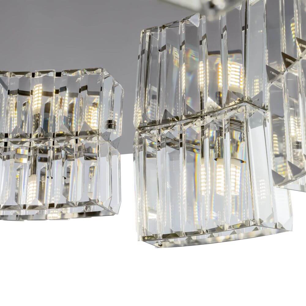 Colline Glas-Pendelleuchte im Asymmetrischen Design mit glanzpolierten Glaselementen und harmonischer Kolonnade.