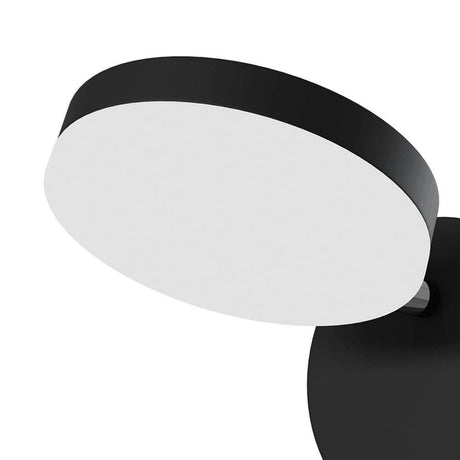 Applique murale Fad LED noire avec abat-jour cylindrique, orientable et fonction Softdimmer.