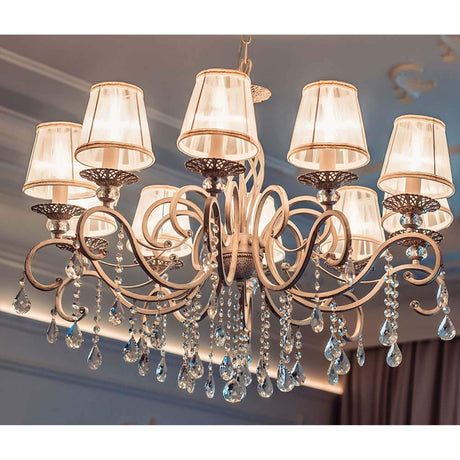 Grace chandelier, 10-light, white and gold, with white lampshades and crystal pendants.