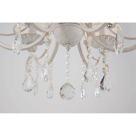 Lustre Grace à 6 flammes avec pendeloques en cristal et cadre en métal blanc.