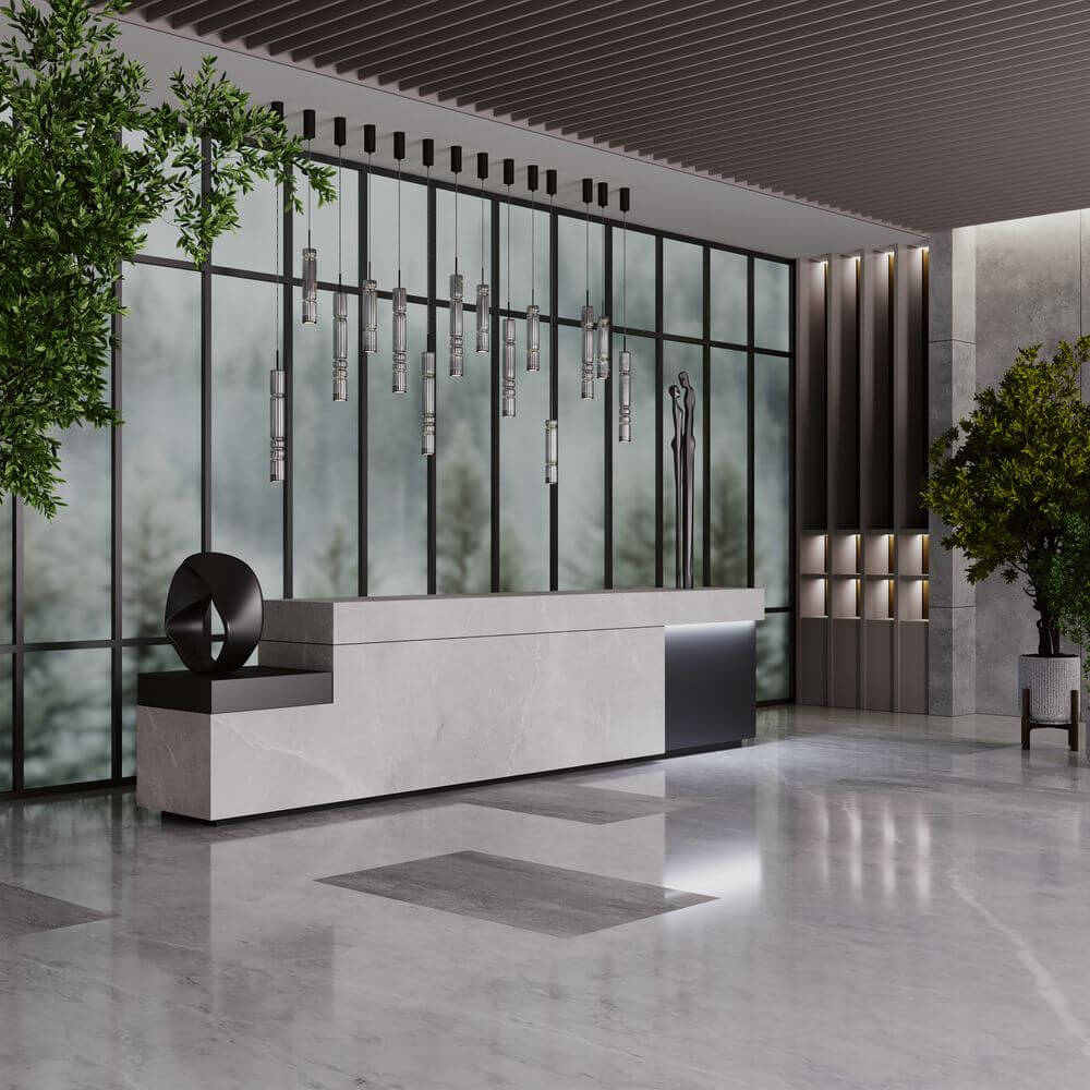 Moderne Empfangshalle mit LED Hängeleuchte Ordo XL, eleganter Empfangstresen und stilvollen Pflanzen.