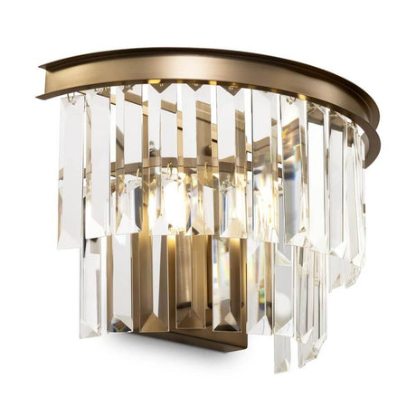 Revero wall light with multi-tier crystal pendants and lacquered metal fittings in brass.
