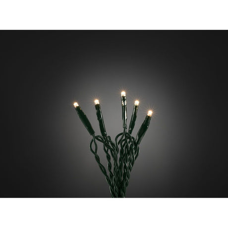 10 m Micro LED-lichterkette met 20 warmwitte diodes op een donkere achtergrond met lichtgevende lampjes.