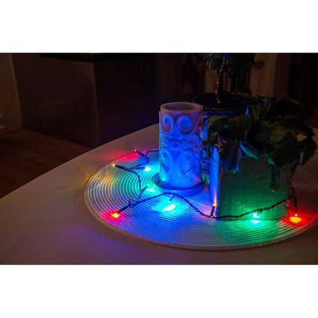 5m Micro LED string lights, 10 multicolored diodes decorated with plants and a candle on a table.