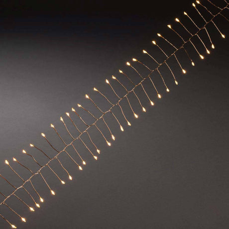 7m mikro LED Fairy lights Firecracker 200 gule dioder kobbertråd på sort baggrund