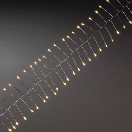1,5m Micro LED Lichterkette Firecracker mit Timer 60 bernsteinfarbene Dioden batteriebetrieben Innen auf filigranem Draht.