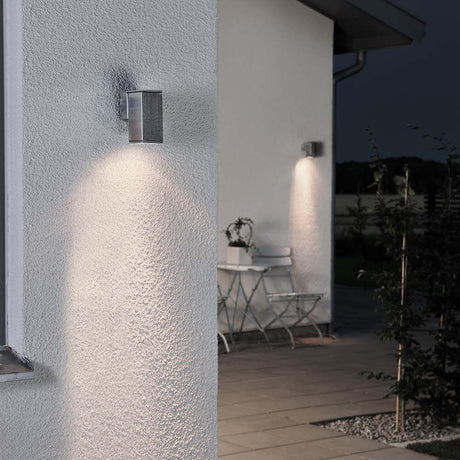 Monza outdoor wall light, clear glass, reflector on a house wall, atmospheric lighting.