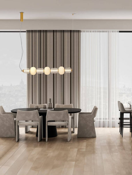 Elegant furnishing with Movil LED pendant light 7-light 3000K Gold above the dining table.