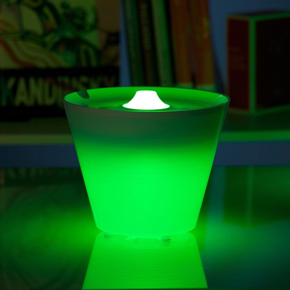 Rotaliana Multipot+ table lamp cable container + charging station white in green light