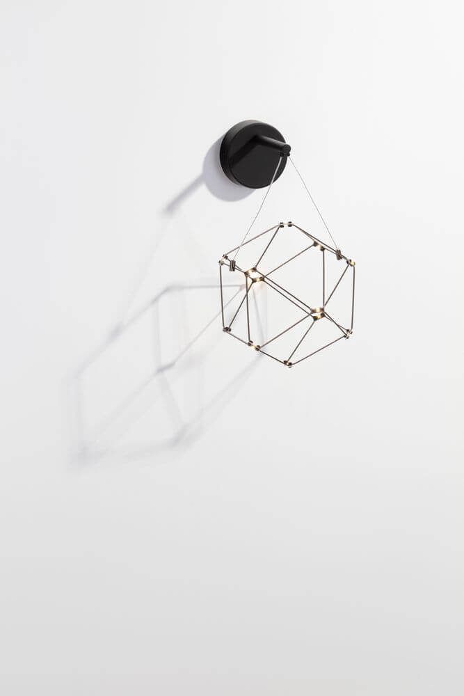 Nebula LED Wandleuchte Ø 23,4cm 3000K an der Wand mit geometrischem Design und sanfter Beleuchtung.
