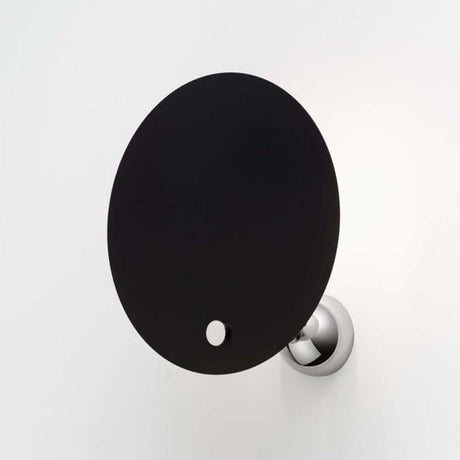 Nemo Kuta wall light for indirect light with black reflector and chrome-plated wall bracket.