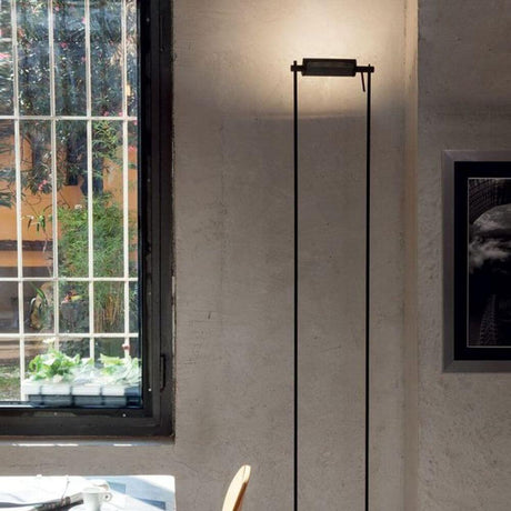 Nemo Logo LED Stehlampe 193cm in modernem Raum mit Fenster und Kunstwerk.