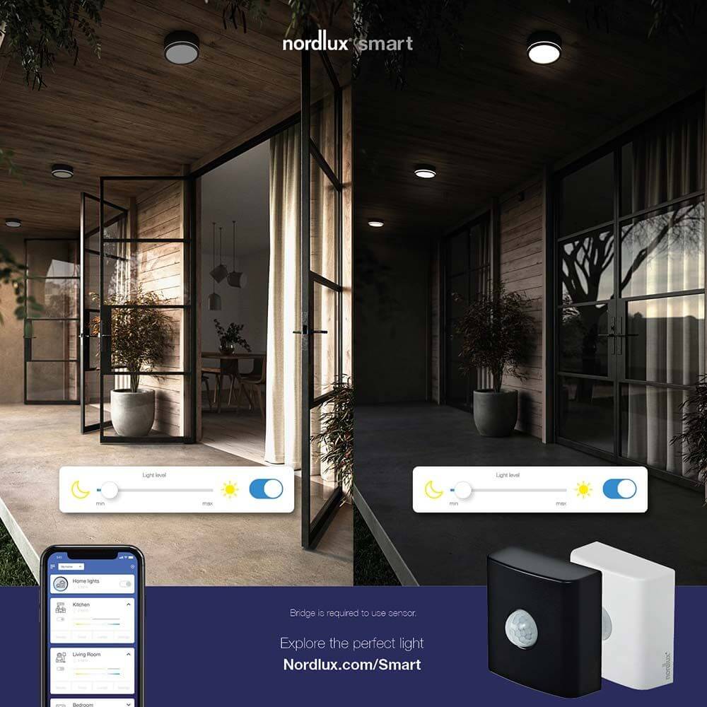 Smart Bewegungs Sensor in einem modernen Außenbereich mit Fernsteuerung über die Nordlux Smart Light App.