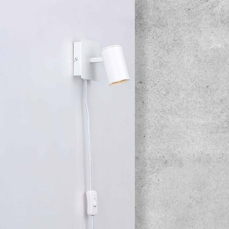 Spot wall light Frida White on a wall with adjustable spotlight for direct light.