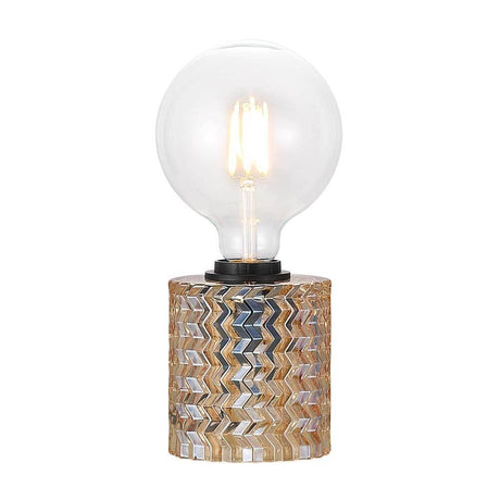 Lampe de table Hollywood Ambre avec tête en verre ronde et socle décoratif en matériau stratifié.