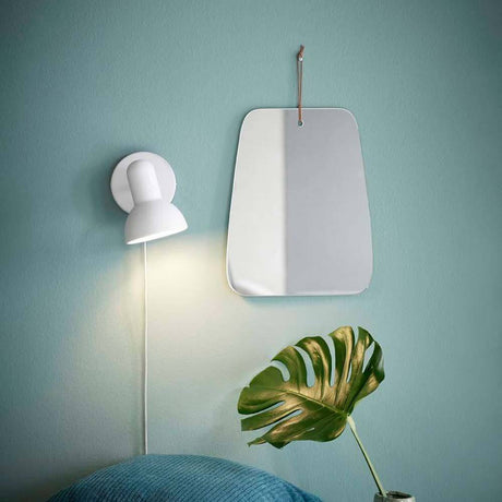 Wall spotlight Texas white next to a mirror and a plant on a wall in a stylish room.