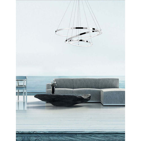 Aria LED Krom hængelampe over moderne stue med grå sofa og bord.