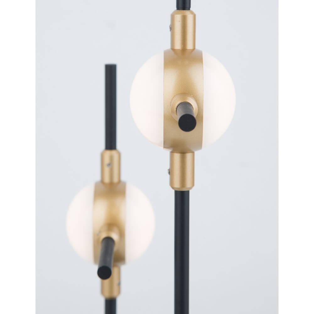 Atomo LED Tischleuchte im modernen Design mit goldenen und schwarzen Akzenten.