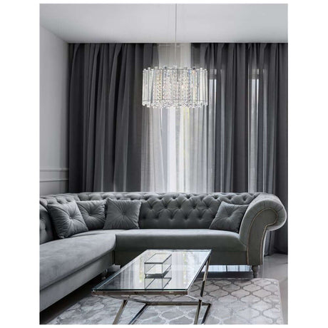 Element krystall-pendellampe Ø 41cm over en elegant sofa i en stilfull stue.
