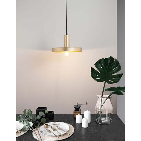 Garni pendant lamp metal above a stylish dining table with modern decorative elements.
