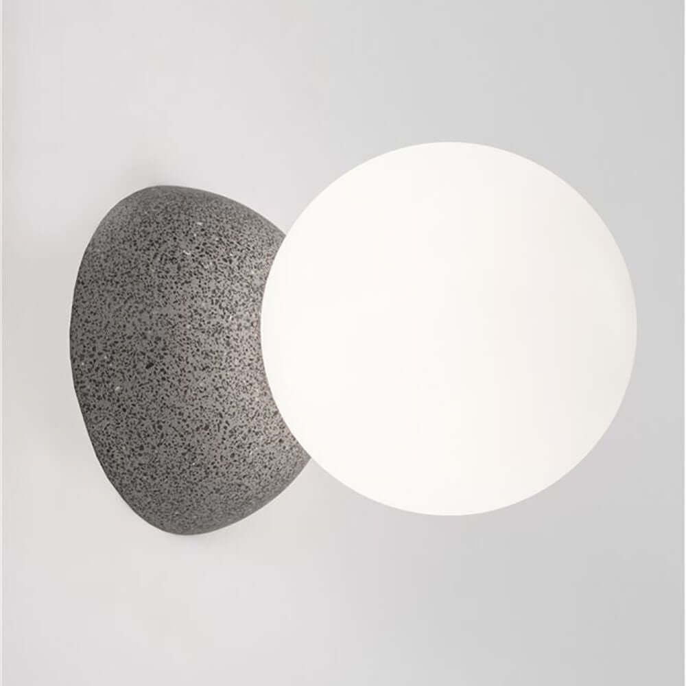 Zero Wandleuchte Rund mit modernem Design in Weiß und Grauton, ideal für verschiedene Wohnräume.
