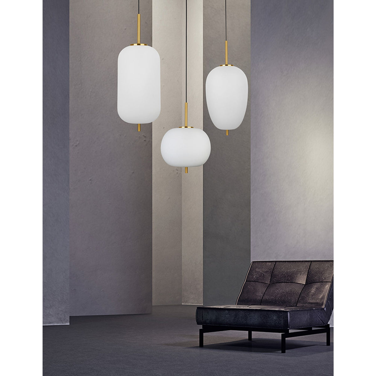 Nova Lace Lato pendant lamp with three opal-white glass spheres and brass mounts in a modern interior setting