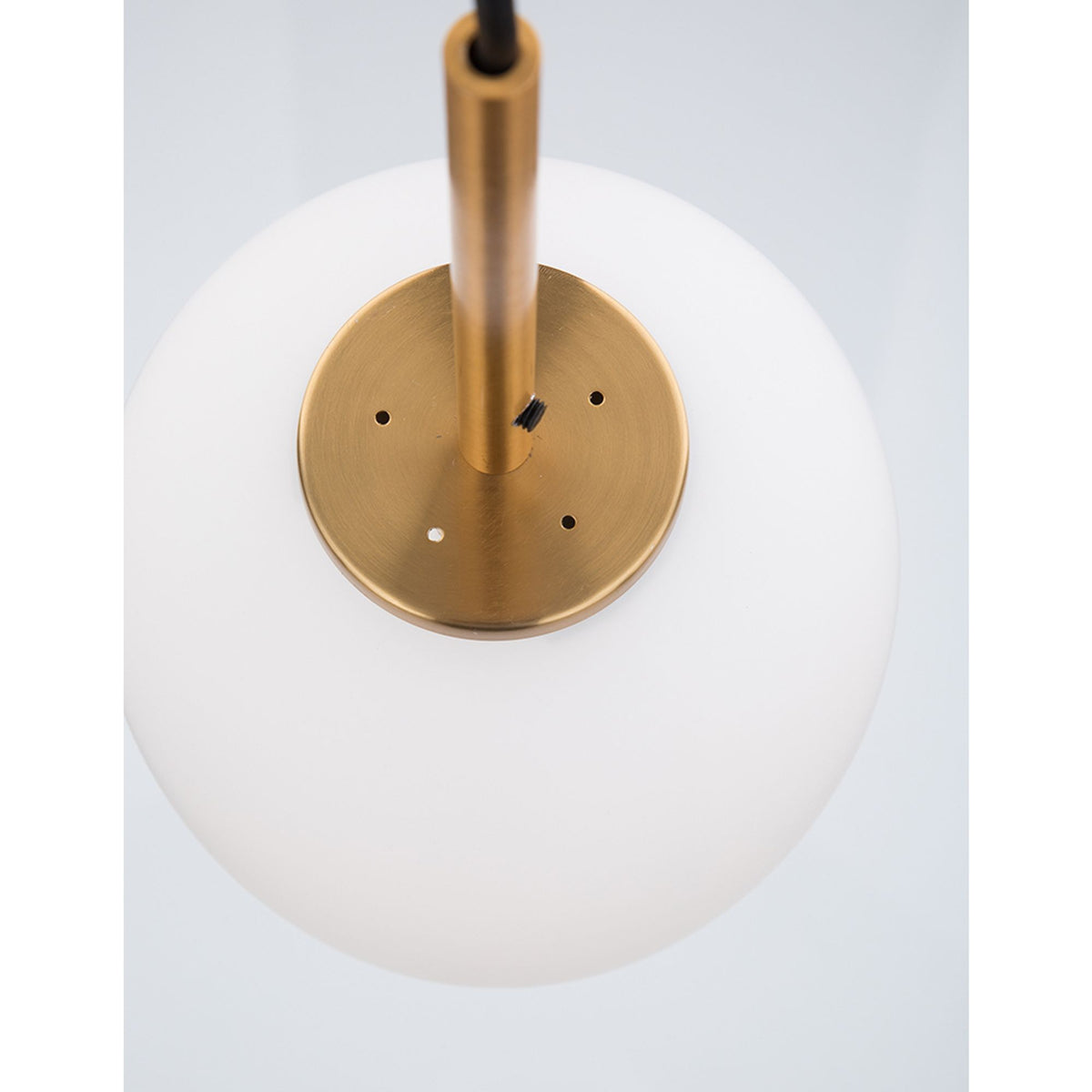 Nova Lace Lato pendant lamp with an opal-white glass body and brass mount, top view