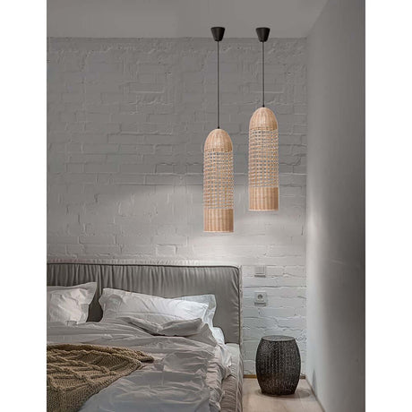 Mia pendant lamp Rattan above a bed in a modern bedroom with rattan lamps and black textile cable.