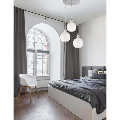 Odell 3-light pendant light Opal White in the bedroom with elegant design and natural light.