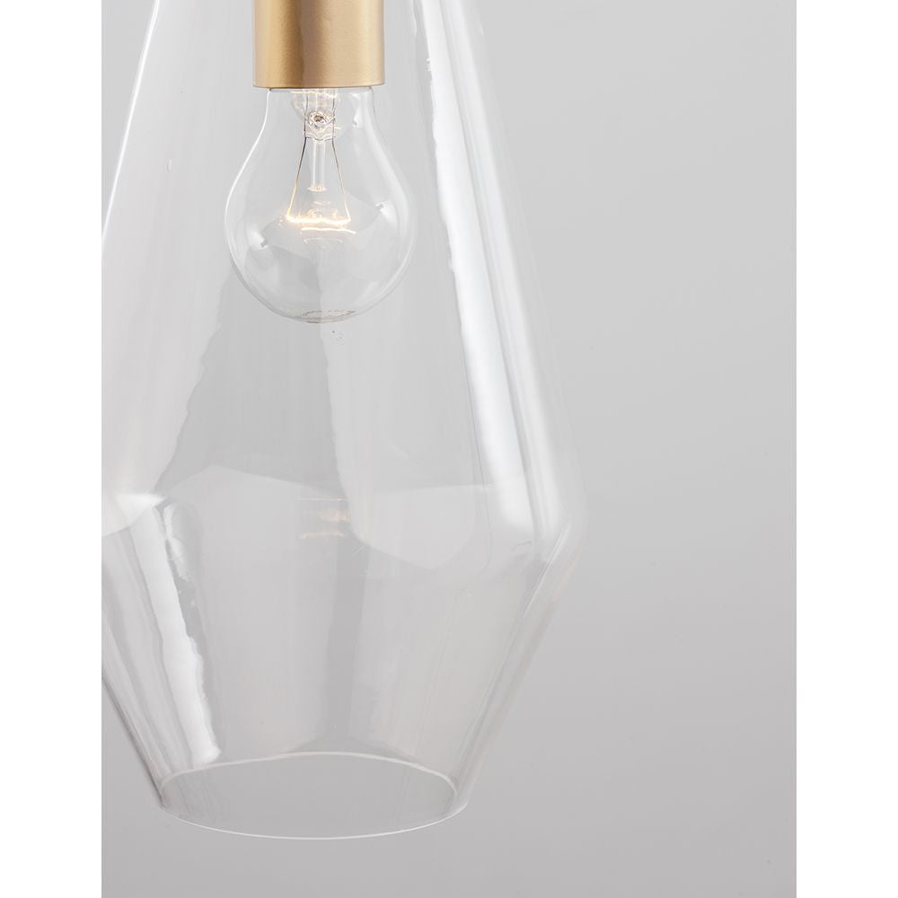 Prisma Hängelampe aus klarem Glas mit goldener Metallhalterung für modernes Wohndesign.