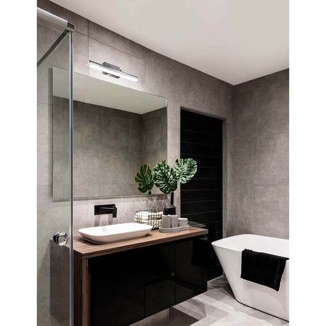 Vanese LED bathroom wall light IP44 chrome in a stylish bathroom with modern design and plants.