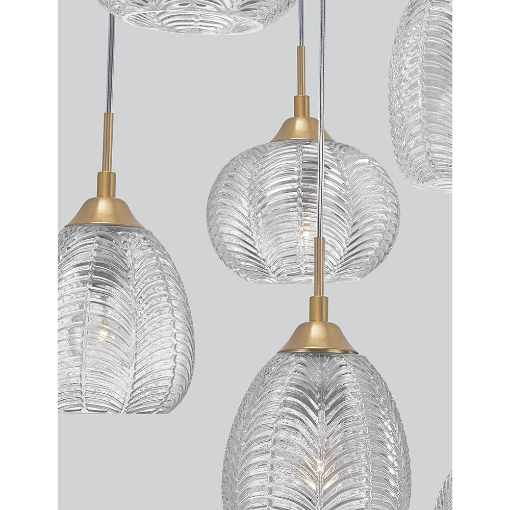 Vario Glas Hängeleuchte 6-flg. in Gold und klarem Glas, modernes Design mit eleganten, gerippten Lampenschirmen.