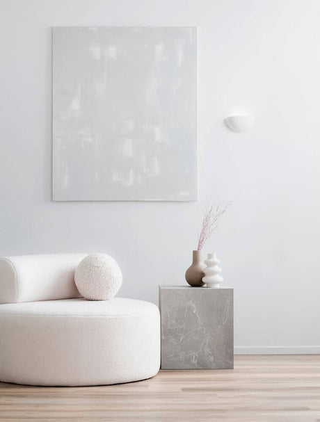 Onica LED wall light 3000K white in a bright room with modern furniture and decor.