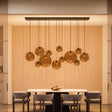 s.luce Orb Esszimmerlampe 12-flammig 160cm 2-reihig – moderne Pendelleuchte über Esstisch in stilvollem Raum.
