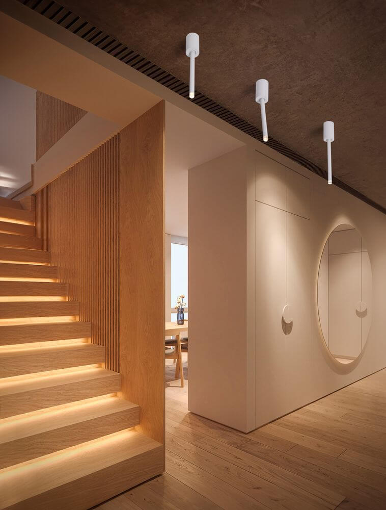 Moderne Ornos Deckenleuchte Ø 5cm H 29,5cm 3000K im Innenbereich über einer Treppe.