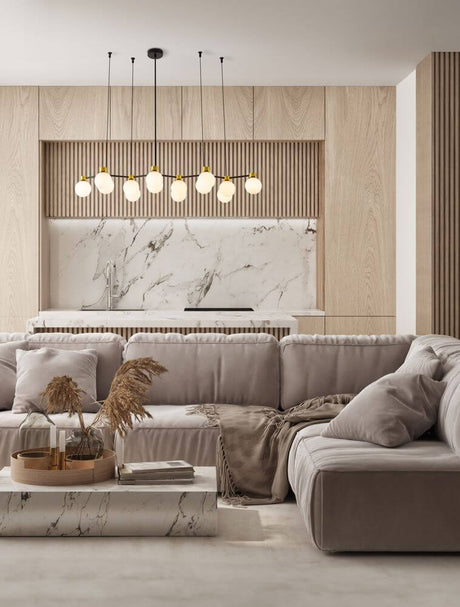 Ovalino pendel 14-pære satin guld, sort, hvid i en elegant stue med et moderne design