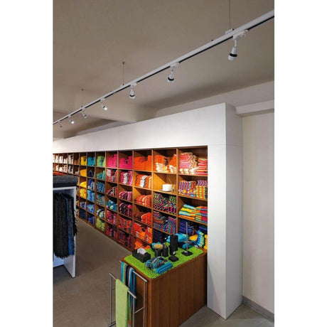 PURI lamp head white GU10 max. 50W incl. 3-phase adapter in a modern retail store.