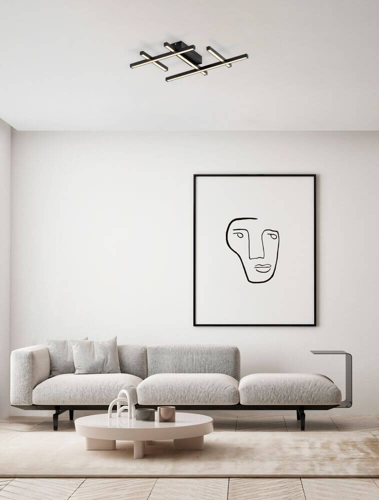 Pace LED Deckenleuchte 58cm 5-flammig 3000K Weiß in modernem Wohnraum mit Sofa und Kunstwerk an der Wand.