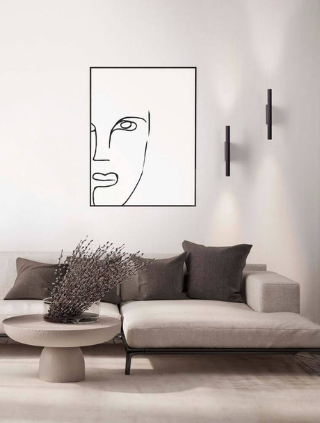 Paron LED ribbed wall light 3000K on a stylish wall in the living room, emphasizing modern design.
