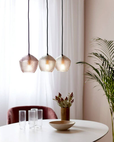 Orbiform 3-spot pendant light in a modern room with three hanging lamps, lustrous design.